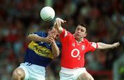 21 July 2002; Joe Kavanagh of Cork reaches for the ball ahead of Sean Collum of Tipperary during the Bank of Ireland Munster Football Final Replay match between Cork and Tipperary at Páirc Uí Chaoimh in Cork. Photo by Brendan Moran/Sportsfile