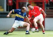 21 July 2002; Joe Kavanagh of Cork in action against Sean Collum of Tipperary during the Bank of Ireland Munster Football Final Replay match between Cork and Tipperary at Páirc Uí Chaoimh in Cork. Photo by Brendan Moran/Sportsfile