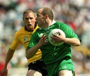 21 July 2002; Ollie Murphy of Meath is tackled by Noel McGinely of Donegal during the All-Ireland Senior Football Championship Qualifier Round 4 match between Meath and Donegal at Croke Park. Photo by Brian Lawless/Sportsfile
