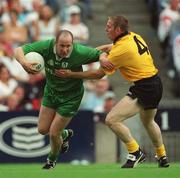 21 July 2002; Ollie Murphy of Meath is tackled by Noel McGinley of Donegal during the All-Ireland Senior Football Championship Qualifier Round 4 match between Meath and Donegal at Croke Park. Photo by Brian Lawless/Sportsfile
