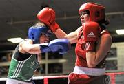 23 March 2012; Katie Taylor, Ireland, left, exchanges punches with Jessica Belder, Holland, during their 60kg bout. Women's Boxing International, Ireland v Holland, National Stadium, Dublin. Picture credit: Barry Cregg / SPORTSFILE