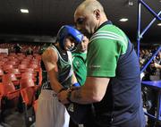 23 March 2012; Katie Taylor, Ireland, and coaches Zaur Antia, centre, and father Pete prepare for her 60kg bout against Jessica Belder, Holland. Women's Boxing International, Ireland v Holland, National Stadium, Dublin. Picture credit: Barry Cregg / SPORTSFILE