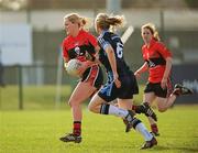 25 March 2012; Kelly Hackett, University College Cork, in action against Neamh Woods, University of Ulster Jordanstown. O'Connor Cup Final, University of Ulster Jordanstown v University of College Cork, Queen's University Belfast, University Road, Belfast. Picture credit: Oliver McVeigh / SPORTSFILE