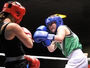 23 March 2012; Christine Gargan, right, Ireland, exchanges punches with Alicia Holsken, Holland, during their 52kg bout. Women's Boxing International, Ireland v Holland, National Stadium, Dublin. Picture credit: Barry Cregg / SPORTSFILE