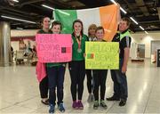 24 July 2017; Michaela Walsh, who won bronze in the Hammer, pictured with her cousins Mikey Gallagher, right, age 13, and Dylan Gallagher, age 10, and other family members at the homecoming of the Irish Team from the European Athletics Under-20 Championships in Italy at Dublin Airport. Photo by Sam Barnes/Sportsfile