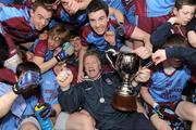 19 March 2012; St. Michael’s manager Dominic Corrigan celebrates with the cup alongside players and supporters. MacRory Cup Final, St. Patrick’s, Maghera v St. Michael’s, Enniskillen, Bessbrook, Morgan Athletic Grounds, Armagh. Picture credit: Oliver McVeigh / SPORTSFILE