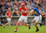 1 April 2012; Lorcan McLoughlin, Cork, in action against James Woodlock, Tipperary. Allianz Hurling League Division 1A, Round 5, Tipperary v Cork, Semple Stadium, Thurles, Co. Tipperary. Picture credit: Brendan Moran / SPORTSFILE