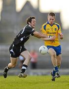 7 April 2012; Niall Daly, Roscommon, in action against David Maye, Sligo. Cadbury Connacht GAA Football Under 21 Championship Final, Roscommon v Sligo, Dr. Hyde Park, Co. Roscommon. Photo by Sportsfile