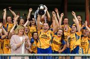 5 August 2017; Clare captain Kate Dillon lifts the cup in the company of LGFA President Marie Hickey after the All Ireland Ladies Football Minor B Final match between Clare and Meath at Duggan Park in Ballinasloe, Co. Galway. Photo by Diarmuid Greene/Sportsfile