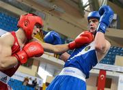 16 April 2012; Tomasz Kot, Poland, left, exchanges punches with Adam Nolan, Ireland, during their Welterweight 69kg bout. AIBA European Olympic Boxing Qualifying Championships, Hayri Gür Arena, Trabzon, Turkey. Picture credit: David Maher / SPORTSFILE