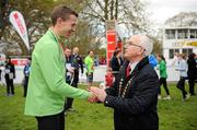 15 April 2012; Third place in the AAI Men's National 10km Championships Barry Minnock, Rathfarnham WSAF A.C., is presented with his medal by Liam Hennessy, President of Athletics Ireland, at the SPAR Great Ireland Run 2012. Phoenix Park, Dublin. Picture credit: Stephen McCarthy / SPORTSFILE
