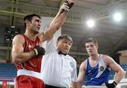 16 April 2012; A dejected Joe Ward, Ireland, right, as Bahram Muzaffer, Turkey, is declared the winner at the end of their Light Heavyweight 81kg bout. AIBA European Olympic Boxing Qualifying Championships, Hayri Gür Arena, Trabzon, Turkey. Picture credit: David Maher / SPORTSFILE