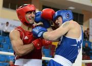 16 April 2012; Joe Ward, Ireland, right, exchanges punches with Bahram Muzaffer, Turkey, during their Light Heavyweight 81kg bout. AIBA European Olympic Boxing Qualifying Championships, Hayri Gür Arena, Trabzon, Turkey. Picture credit: David Maher / SPORTSFILE