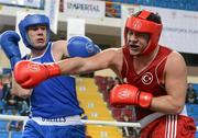 16 April 2012; Con Sheehan, Ireland, left, exchanges punches with Erhan Aci, Turkey, during their Super Heavyweight 91+kg bout. AIBA European Olympic Boxing Qualifying Championships, Hayri Gür Arena, Trabzon, Turkey. Picture credit: David Maher / SPORTSFILE