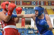 16 April 2012; Con Sheehan, Ireland, right, exchanges punches with Erhan Aci, Turkey, during their Super Heavyweight 91+kg bout. AIBA European Olympic Boxing Qualifying Championships, Hayri Gür Arena, Trabzon, Turkey. Picture credit: David Maher / SPORTSFILE