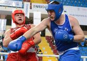 16 April 2012; Con Sheehan, Ireland, right, exchanges punches with Erhan Aci, Turkey, during their Super Heavyweight 91+kg bout. AIBA European Olympic Boxing Qualifying Championships, Hayri Gür Arena, Trabzon, Turkey. Picture credit: David Maher / SPORTSFILE