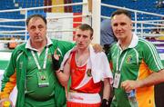17 April 2012; Paddy Barnes, Ireland, celebrates with head coach Billy Walsh, right, and assistant coach Zaur Anita, after victory over Istvan Ungvari, Hungary, in their Lightfly 46-49kg bout. AIBA European Olympic Boxing Qualifying Championships, Hayri Gür Arena, Trabzon, Turkey. Picture credit: David Maher / SPORTSFILE