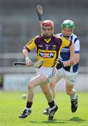 15 April 2012; Willie Devereaux, Wexford, in action against Tommy Fitzgerald, Laois. Allianz Hurling League Division 1B Relegtion Play-off, Wexford v Laois, Nowlan Park, Kilkenny. Picture credit: Brian Lawless / SPORTSFILE