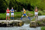 18 April 2012; Clare’s Pat Donnellan jumps the gap in the rocks as Cork’s Lorcan McLaughlin, Tipperary’s Pa Bourke, Kilkenny’s Richie Power look on, in Holycross Abbey, Thurles, Co. Tipperary, as part of the GAA’s promotion of the Allianz Leagues. This Sunday, April 22nd, in Semple Stadium, Thurles, Kilkenny take on Clare in the first of the Allianz Hurling League Division 1A Semi-Finals at 2pm, while at 4pm Tipperary take on Cork in the other Semi-Final. Holycross Abbey, Thurles, Co. Tipperary. Picture credit: Matt Browne  / SPORTSFILE