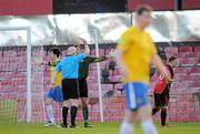 20 April 2012;  Monaghan United goalkeeper Chris Bennion is shown the red card by referee Dave McKeon. Airtricity League Premier Division, Bohemians v Monaghan United, Dalymount Park, Dublin. Picture credit: Brian Lawless / SPORTSFILE