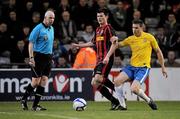 20 April 2012; Dinny Corcoran, Bohemians, in action against Shaun Maher, Monaghan United, as referee Dave McKeon looks on. Airtricity League Premier Division, Bohemians v Monaghan United, Dalymount Park, Dublin. Picture credit: Brian Lawless / SPORTSFILE