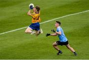 7 August 2017; Joe Miniter of Clare gathers possession ahead of Ross McGarry of Dublin during the Electric Ireland All-Ireland GAA Football Minor Championship Quarter-Final match between Dublin and Clare at O'Moore Park, Portlaoise, in Co. Laois. Photo by Piaras Ó Mídheach/Sportsfile