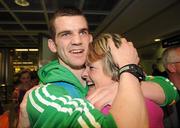 22 April 2012; Ireland's Adam Nolan, who won a gold medal at AIBA European Olympic Boxing Qualifying Championships and qualification for the London Games 2012, celebrates with his mother Anne, on his arrival in Dublin Airport following the qualifying Championships in Trabzon, Turkey. Dublin Airport, Dublin. Picture credit: David Maher / SPORTSFILE