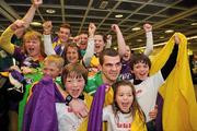 22 April 2012; Ireland's Adam Nolan, who won a gold medal at AIBA European Olympic Boxing Qualifying Championships and qualification for the London Games 2012, celebrates with family and friends on his arrival in Dublin Airport following the qualifying Championships in Trabzon, Turkey. Dublin Airport, Dublin. Picture credit: David Maher / SPORTSFILE