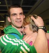 22 April 2012; Ireland's Adam Nolan, who won a gold medal at AIBA European Olympic Boxing Qualifying Championships and qualification for the London Games 2012, celebrates with his mother Anne, on his arrival in Dublin Airport following the qualifying Championships in Trabzon, Turkey. Dublin Airport, Dublin. Picture credit: David Maher / SPORTSFILE