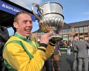 24 April 2012; Jockey Andrew Lynch celebrates with the Blessington cup after winning the Boylesports.com Champion Steeplechase on Sizing Europe. Punchestown Racing Festival, Punchestown Racecourse, Punchestown, Co. Kildare. Picture credit: Barry Cregg / SPORTSFILE