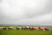 25 April 2012; Runners and riders pass the finishing post, first time around, during the Louis Fitzgerald Hotel Hurdle. Punchestown Racecourse, Punchestown, Co. Kildare. Picture credit: Stephen McCarthy / SPORTSFILE