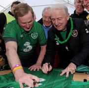 28 April 2012; An Taoiseach Enda Kenny T.D., and Republic of Ireland manager Giovanni Trapattoni sign a Republic of Ireland jersey ahead of the Enda's Trek with Trap's Green Army Charity Climb. Croagh Patrick, Murrisk, Carrowmacloughlin, Co. Mayo. Picture credit: Matt Browne / SPORTSFILE