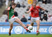 29 April 2012; Cillian O'Connor, Mayo, has a shot on goal despite the attentions of Paudie Kissane, Cork. Allianz Football League, Division 1 Final, Cork v Mayo, Croke Park, Dublin. Picture credit: Oliver McVeigh / SPORTSFILE