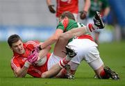 29 April 2012; Eoin Cadogan, Cork, is tackled by the Mayo captain Andy Moran. Allianz Football League, Division 1 Final, Cork v Mayo, Croke Park, Dublin. Picture credit: Ray McManus / SPORTSFILE