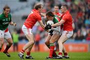 29 April 2012; Barry Moran, Mayo, is tackled by Paudie Kissane, left, and Noel O'Leary, Cork. Allianz Football League, Division 1 Final, Cork v Mayo, Croke Park, Dublin. Picture credit: Ray McManus / SPORTSFILE