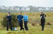 10 May 2012; European Tour Professional Shane Lowry watches his tee shot from the 14th with, from left, Mike Miller, USA, Gary McDermott, Co. Sligo Golf Club, and Simon Ward, Co. Louth Golf Club, during the practice day  of the Irish Amateur Open Golf Championship 2012. Royal Dublin Golf Club, Dublin. Picture credit: Matt Browne / SPORTSFILE