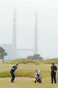 10 May 2012; Gary McDermott, Co. Sligo Golf Club, plays his second from the 11th fairway as European Tour Professional Shane Lowry watches during the practice day of the Irish Amateur Open Golf Championship 2012. Royal Dublin Golf Club, Dublin. Picture credit: Matt Browne / SPORTSFILE