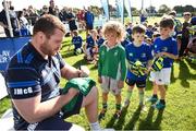 17 August 2017; Leinster's Jack McGrath signs an autograph for Luan McNelis, age 5, during the Bank of Ireland Leinster Rugby Summer Camp at Clontarf RFC in Castle Avenue, Clontarf, Dublin. Photo by Cody Glenn/Sportsfile