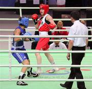 14 May 2012; Katie Taylor, Ireland, right, exchanges punches with Rim Jouini, Tunisia, during their Lightweight 60kg Bout. AIBA Women's World Boxing Championships, Qinhuangdao, China. Picture credit: David Maher / SPORTSFILE