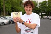 20 May 2012; Eileen Dalton, from Lucan, with her Cadbury Unwrap Gold Olympic Golden Ticket, which she found in her goody bag, at the Tom Byrne Memorial 5K, Lucan, Dubin. Picture credit: Tomas Greally / SPORTSFILE