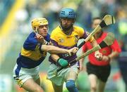 11 August 2002; Joe Codd of Wexford in action against David Kennedy of Tipperary during the All-Ireland Minor Hurling Championship Semi-Final match between Wexford and Tipperary at Croke Park in Dublin. Photo by Damien Eagers/Sportsfile