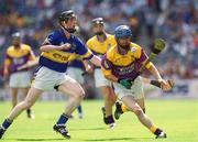 11 August 2002; Joe Codd of Wexford in action against Francis Devanney of Tipperary during the All-Ireland Minor Hurling Championship Semi-Final match between Wexford and Tipperary at Croke Park in Dublin. Photo by Brian Lawless/Sportsfile