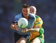17 August 2002; Senan Connell of Dublin is tackled by Paul McGonigle of Donegal during the Bank of Ireland All-Ireland Senior Football Championship Quarter-Final Replay match between Dublin and Donegal at Croke Park in Dublin. Photo by Ray McManus/Sportsfile