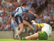 17 August 2002; Ray Cosgrove of Dublin hits the ball past Donegal goalkeeper Tony Blake to score a goal for his side during the Bank of Ireland All-Ireland Senior Football Championship Quarter-Final Replay match between Dublin and Donegal at Croke Park in Dublin. Photo by Ray McManus/Sportsfile