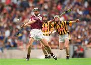 18 August 2002; Iarla Tannian of Galway gets his shot away under pressure from Padraig Holden of Kilkenny during the All-Ireland Minor Hurling Championship Semi-Final match between Kilkenny and Galway at Croke Park in Dublin. Photo by Ray McManus/Sportsfile