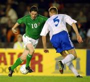 21 August 2002; Robbie Keane of Republic of Ireland in action against Hannu Tihinen of Finland during the International Friendly match between Finland and Republic of Ireland at the Olympic Stadium in Helsinki, Finland. Photo by David Maher/Sportsfile