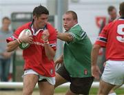 23 August 2002; Eddie Halvey of Munster is tackled by Michael Swift of Connacht during the Representative Friendly match between Connacht and Munster at the Sportsground in Galway. Photo by Matt Browne/Sportsfile