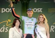 22 May 2012; Marcin Biablocki, Node4 Giordana, is presented with the One Direct stage winners jersey by Rose McManus, One Direct Marketing Manager, and Miss An Post Rás Westport Aoife McGreal following the third stage of the 2012 An Post Rás, into Westport, Co. Mayo. Gort - Westport. Picture credit: Stephen McCarthy / SPORTSFILE