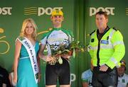 26 May 2012; Brian Ahern, Dublin Dundrum Town Centre, is presented with his Cuchulainn Crystal best place county rider award by Garda Sgt Brendan Hoare and Miss An Post Rás Marie Langan following the seventh stage of the 2012 An Post Rás. Donegal - Cootehill. Picture credit: Stephen McCarthy / SPORTSFILE