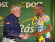 26 May 2012; David Clarke, Node4 Girodana, is presented with the One4All King of the Mountains jersey by Jock Jordan, One4All Group Sales Director, following the seventh stage of the 2012 An Post Rás. Donegal - Cootehill. Picture credit: Stephen McCarthy / SPORTSFILE